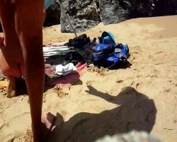 Fucking on a beach while everyone else is confined