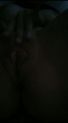 A young blonde masturbates on her bed